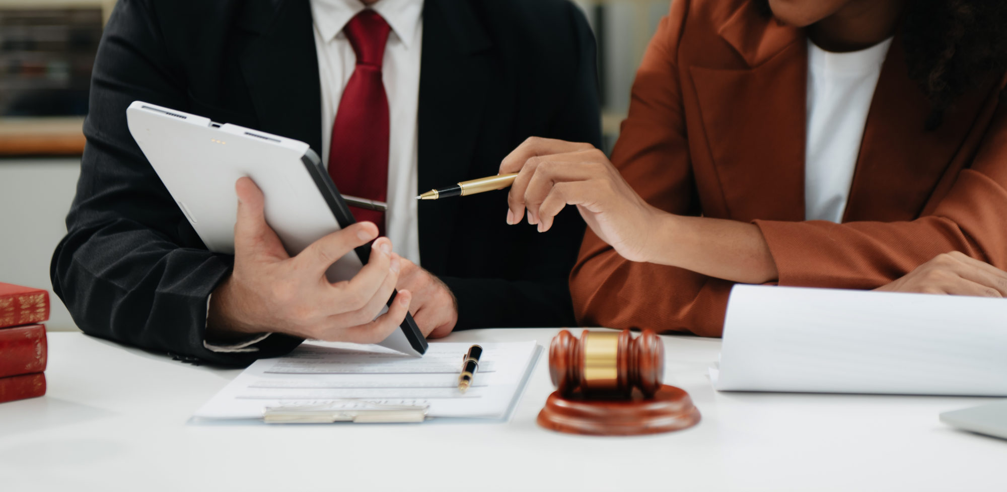 business people and lawyers discussing contract papers sitting at the table. Concepts of law, advice, legal services. in morning light..